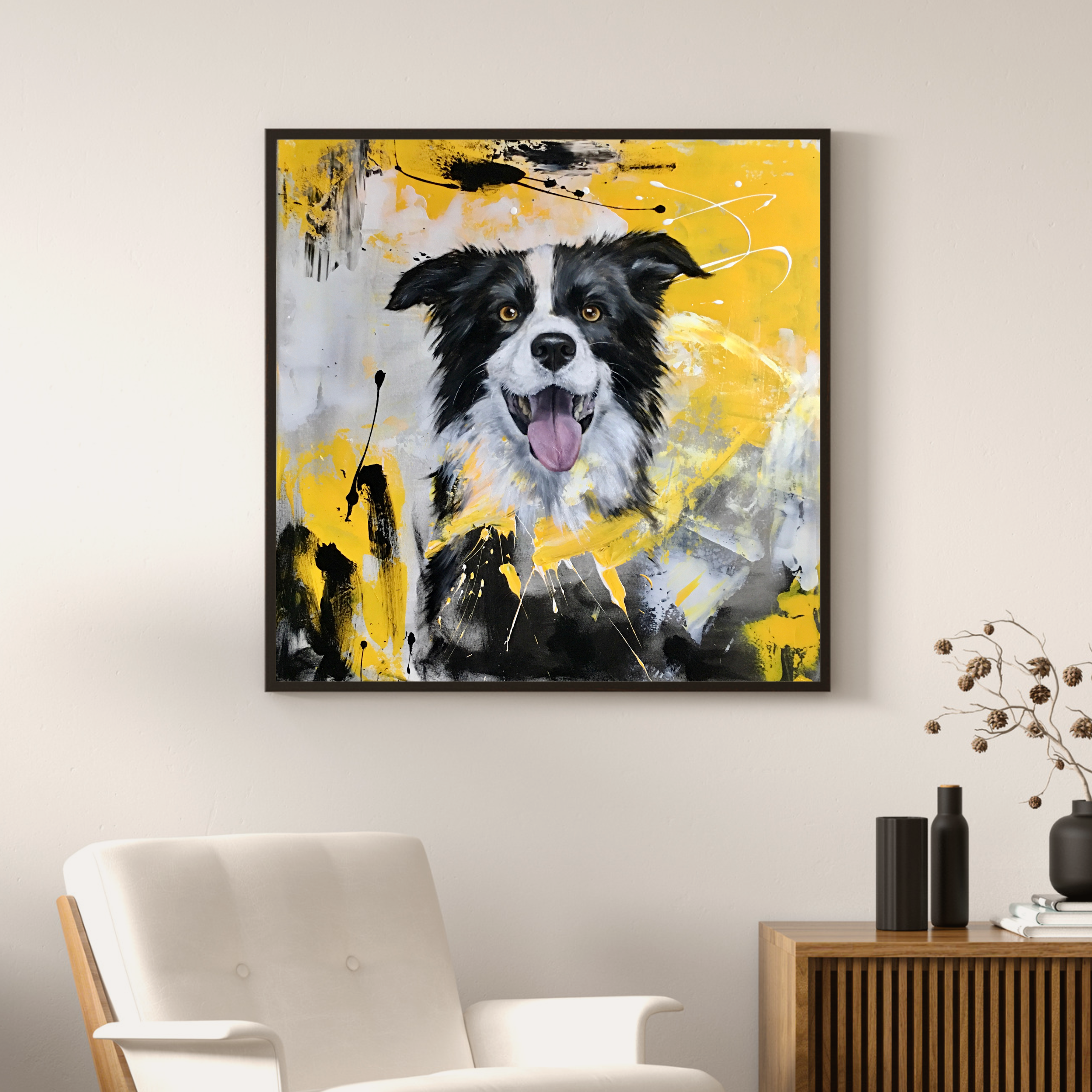 Framed painting of a dog on a wall above a chair in a living room.